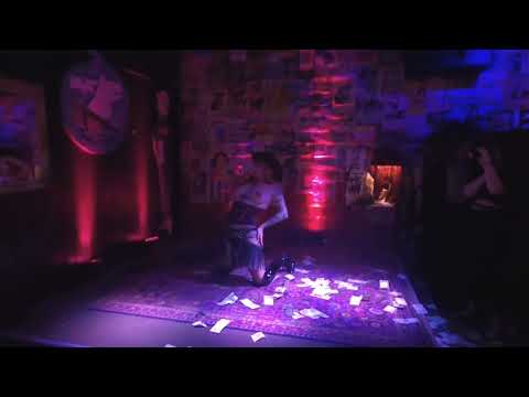 Underground burlesque show in Las Vegas: A redheaded Wild West gunslinger and her ample assets